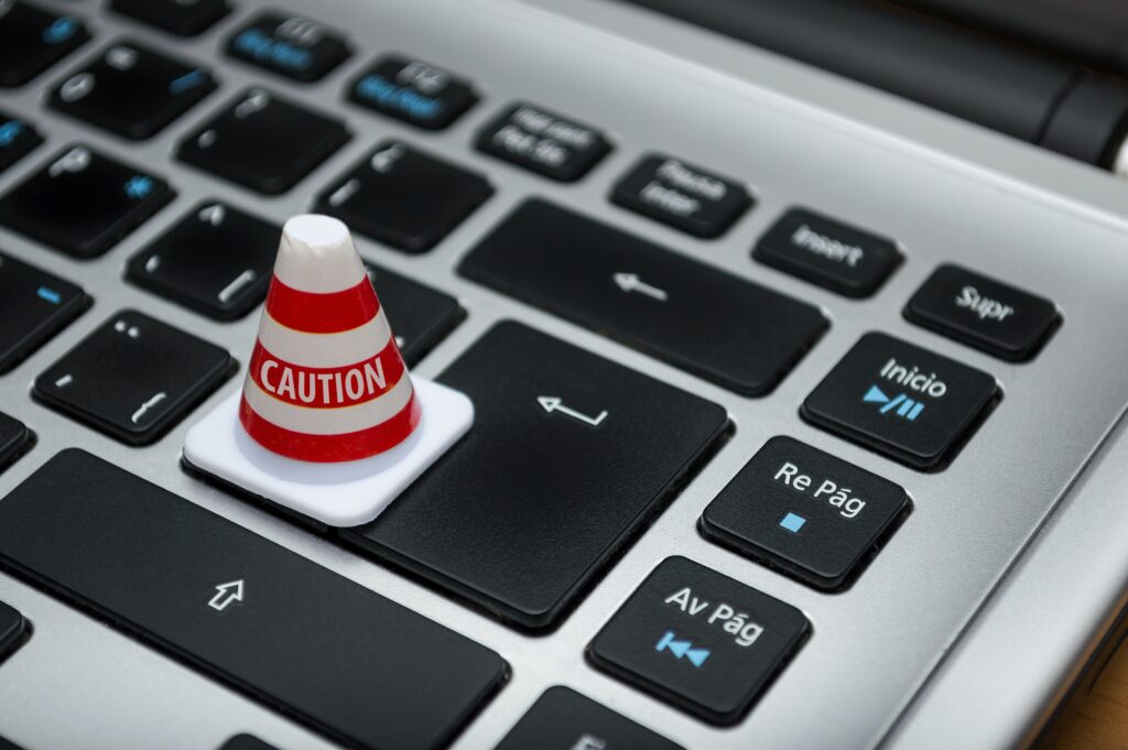 caution cone on a computer keyboard