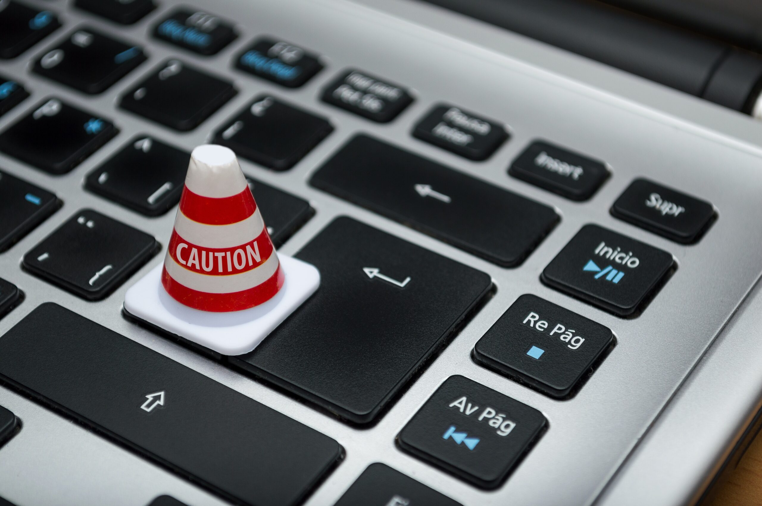 caution cone on a computer keyboard